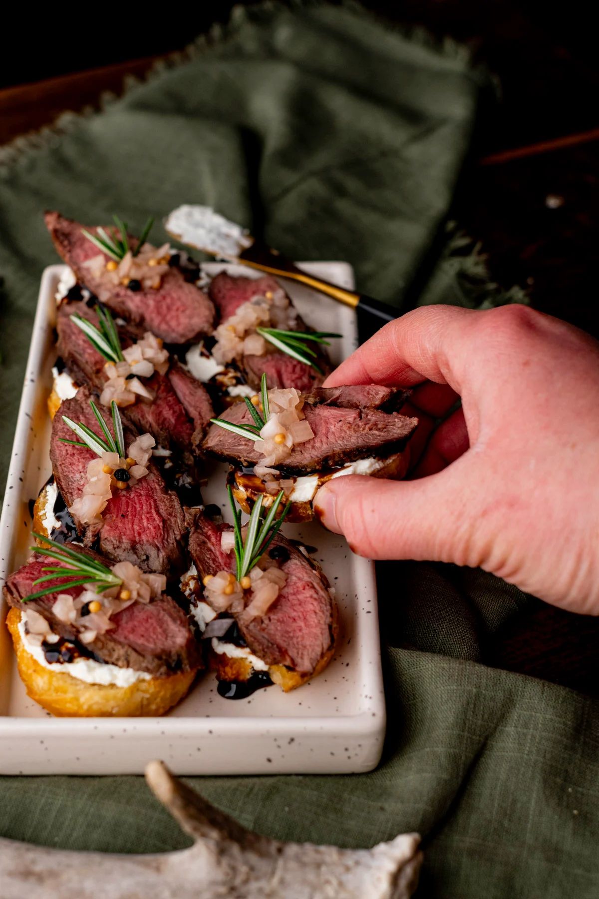 Venison Crostini with Whipped Goat Cheese and Pickled Shallots